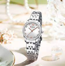 1707756289images.jpg Reloj Curren 9086 En Acero Para Mujer